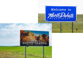 welcome signs for south and north dakota with green field in the background